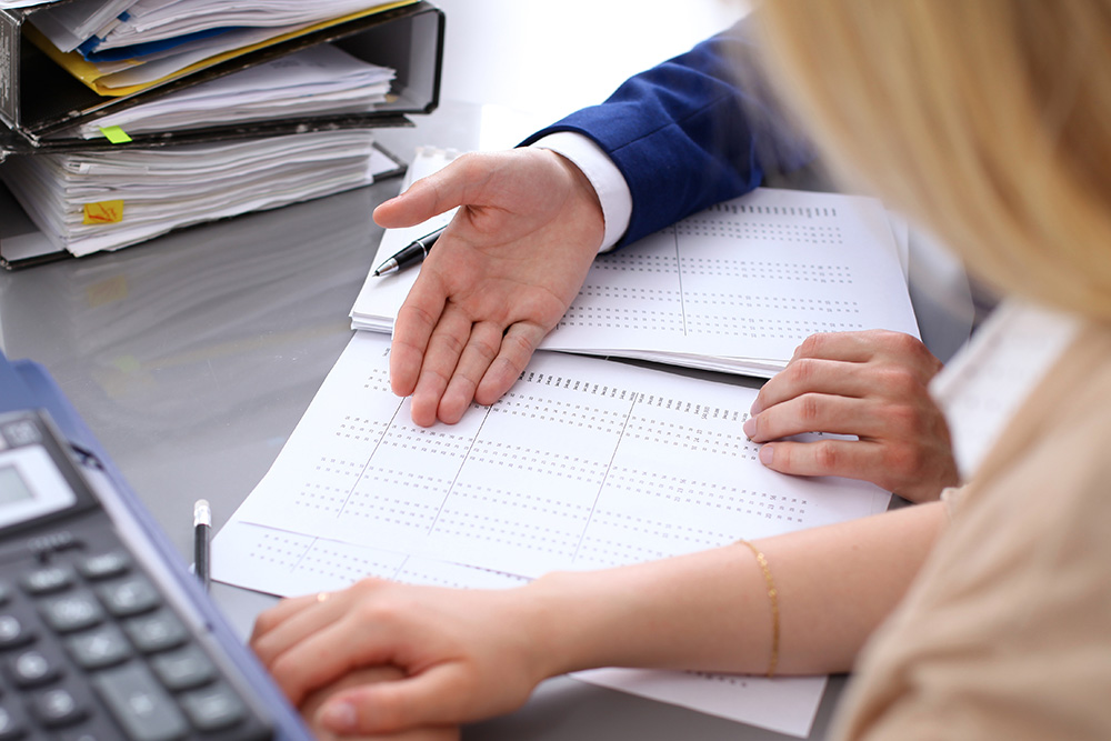 Debt collection lawyers looking at reports Debt collection lawyers looking at reports