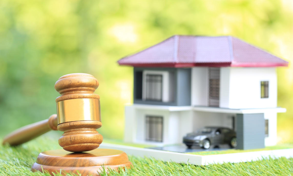 Miniature house & a gavel - Understanding Real Property Liens